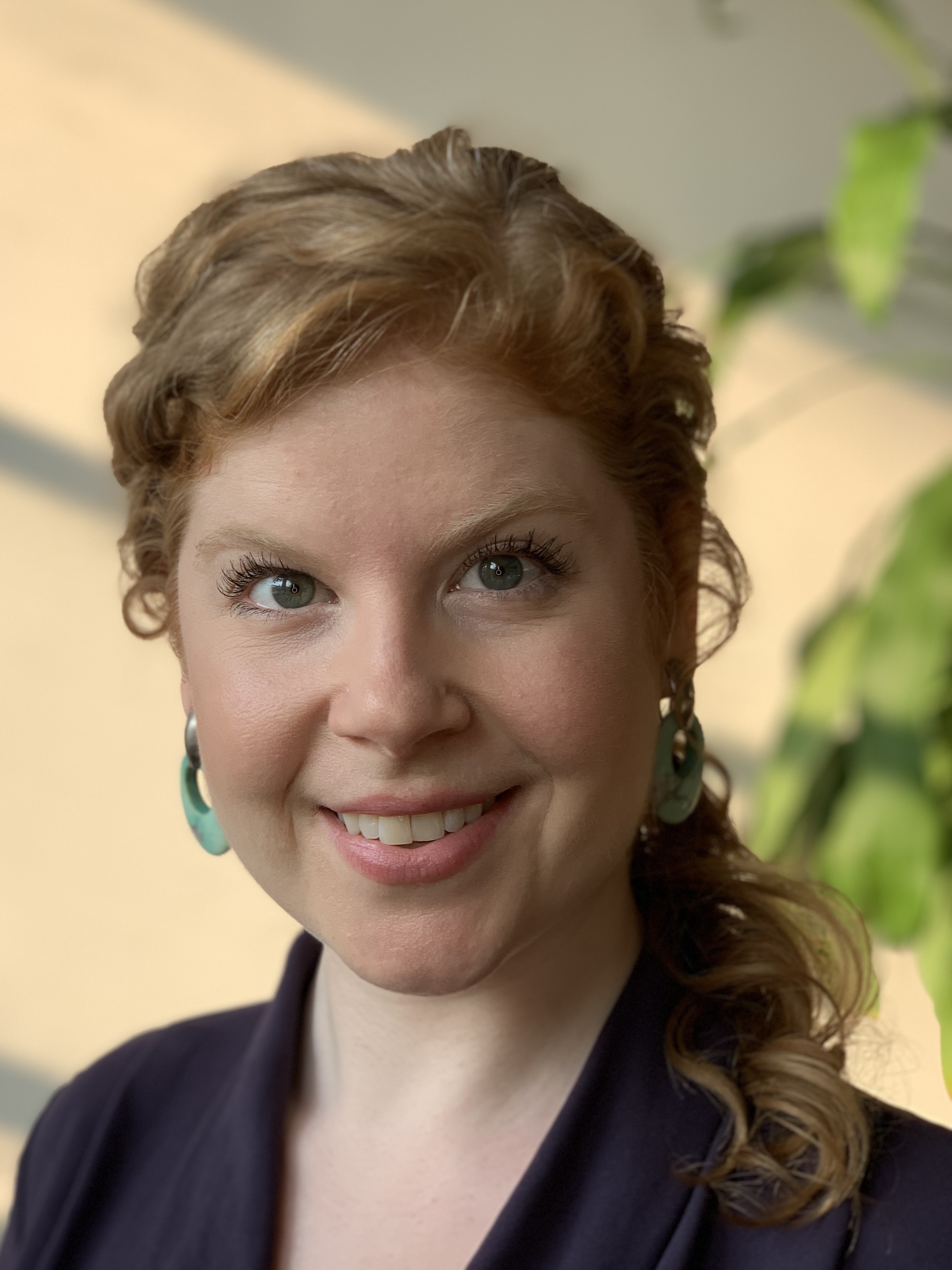 Amelia Norvell in warm window light